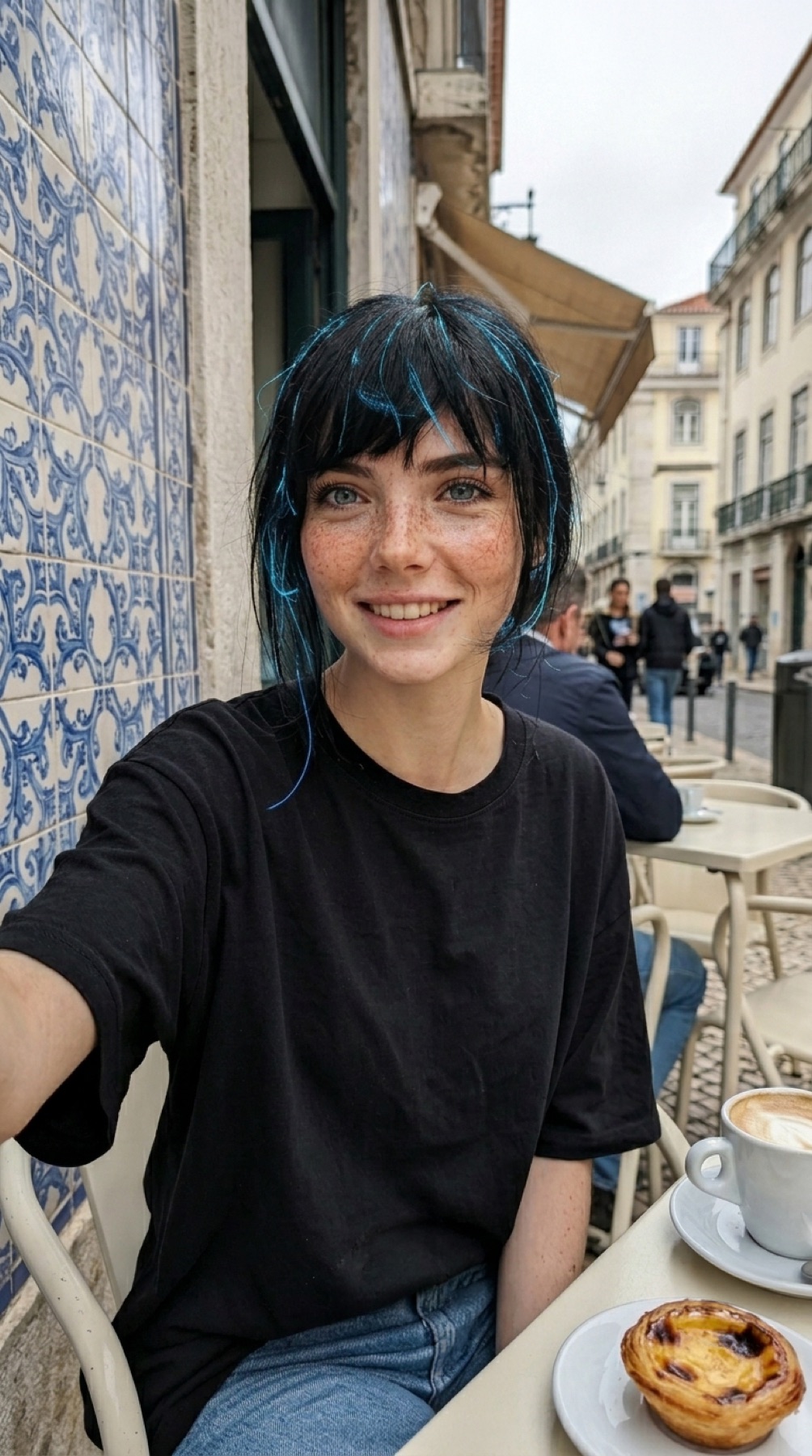 Aria taking a portrait at an outdoor café